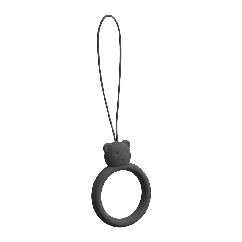 Um cordão de silicone para um anel de urso de telefone em um dedo preto